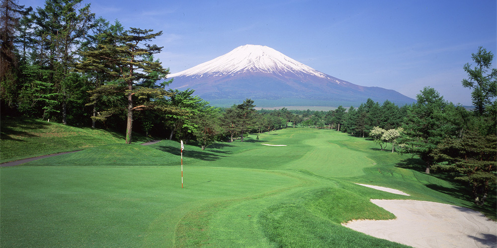 A green at Fuji Golf Course with Mt. Fuji directly behind it